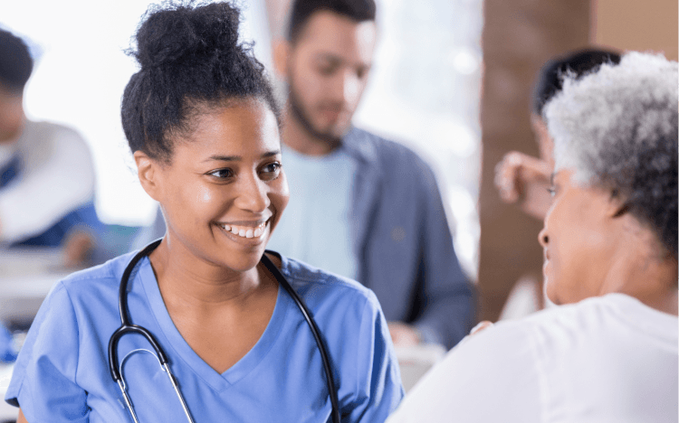 Healthcare working smiling at patient